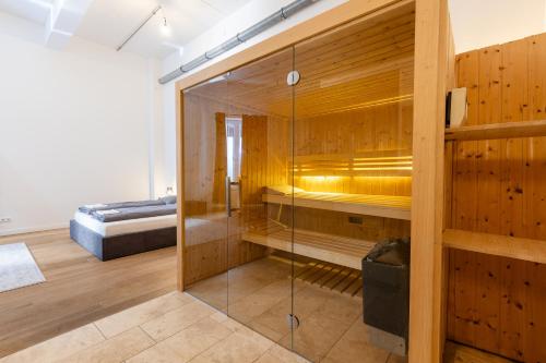 En eller flere senge i et værelse på Pempelfort Luxury Townhouse