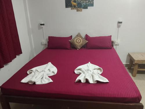 Ένα ή περισσότερα κρεβάτια σε δωμάτιο στο NARESH Holiday Home