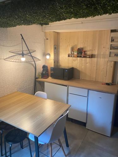 Posezení v ubytování Appartement avec Jaccuzi & Jardin