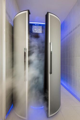 a elevator in a bathroom with smoke coming out of it at Hotel Barátság in Hajdúszoboszló