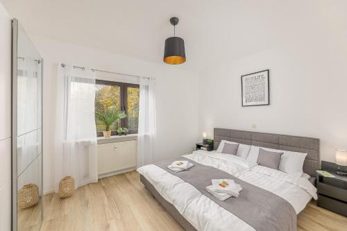 Postel nebo postele na pokoji v ubytování Amaela Design-Wohnung, SAP, Parkplatz, Balkon, NEU