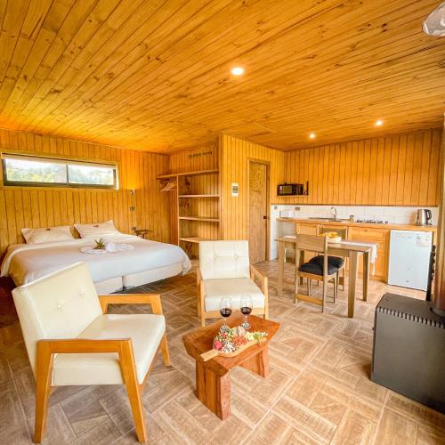 Ένα ή περισσότερα κρεβάτια σε δωμάτιο στο Cabañas Rimü - Cabaña para 2 personas