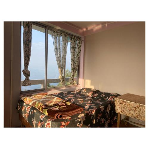 Postel nebo postele na pokoji v ubytování Ridges & Beyond Homestay