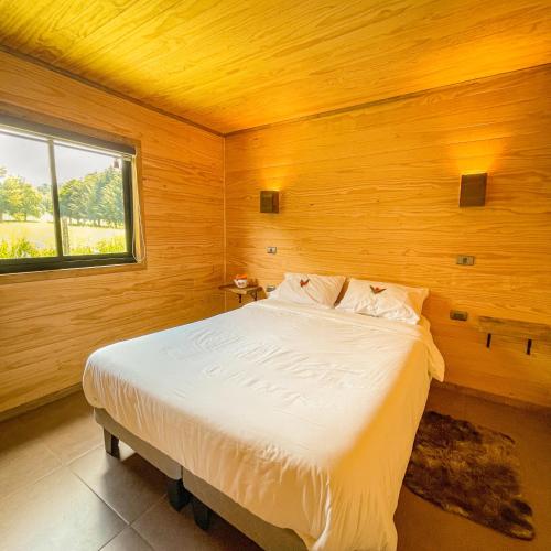 Postel nebo postele na pokoji v ubytování Cabañas Rimü - Cabaña para 6 personas