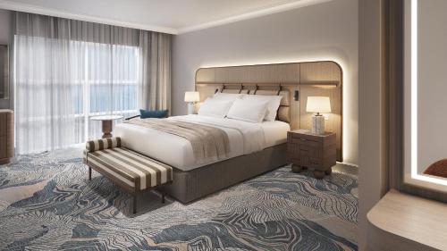 a hotel room with a bed and a window at InterContinental Hotels Table Bay Cape Town by IHG in Cape Town