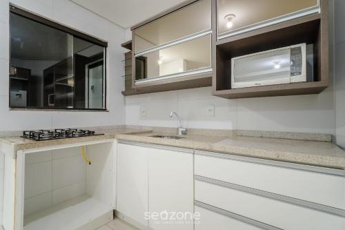 Köök või kööginurk majutusasutuses Aptos em Condo com Piscina em Floripa - GVM