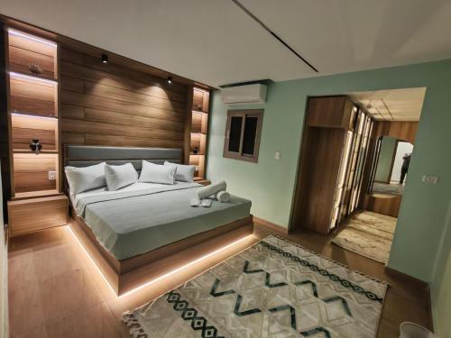 Postel nebo postele na pokoji v ubytování Tahrir apartments