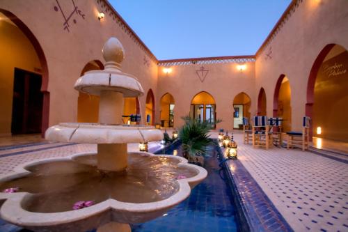 a fountain in the courtyard of a building at Hotel Berber Palace Merzouga in Hassilabied
