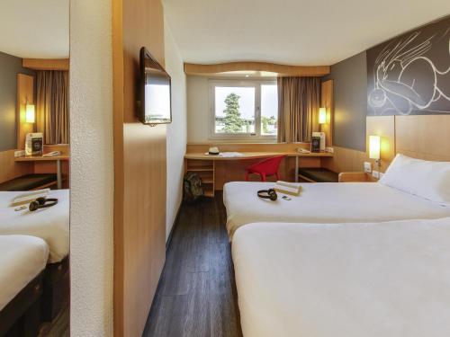 Postel nebo postele na pokoji v ubytování ibis Montpellier Sud