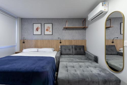 Ένα ή περισσότερα κρεβάτια σε δωμάτιο στο GO Carlos Gomes