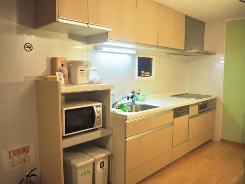 Η κουζίνα ή μικρή κουζίνα στο 関西空港近く- JR日根野駅前 The Palm guest house