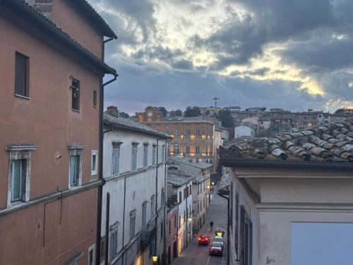 a view of a city street with buildings and cars at Alloggio Turistico LA TORRE in Acquapendente