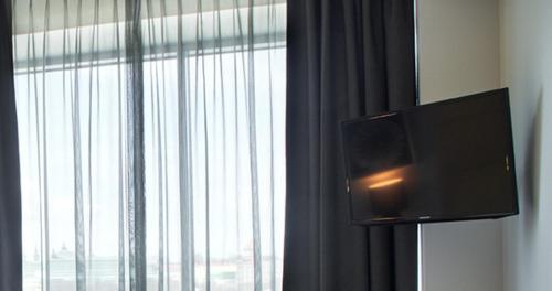 TV a/nebo společenská místnost v ubytování Tallink City Hotel