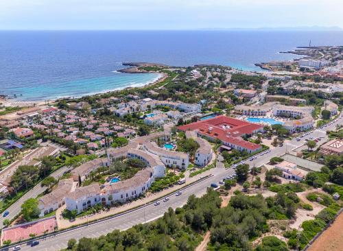 an aerial view of a resort next to the ocean at Sol Falcó Menorca in Son Xoriguer
