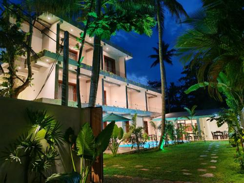 an exterior view of a resort at night at Amarante Madiha in Matara