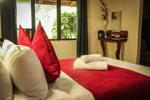 Ένα ή περισσότερα κρεβάτια σε δωμάτιο στο The Red Oak Guesthouse