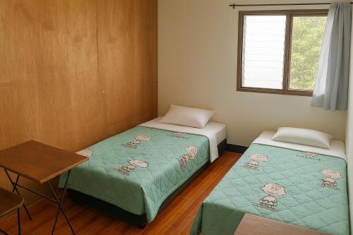 Ένα ή περισσότερα κρεβάτια σε δωμάτιο στο Rose's Roadhouse