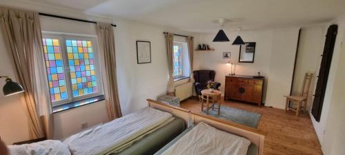 a bedroom with a bed and a stained glass window at Zu Gast im Denkmal St Peter in Dormagen