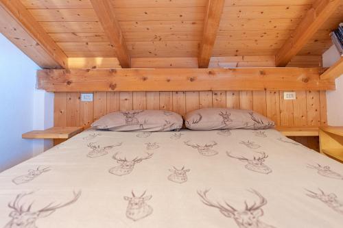 Ένα ή περισσότερα κρεβάτια σε δωμάτιο στο Chalet Bike & Family