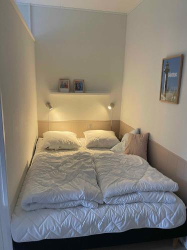 Ένα ή περισσότερα κρεβάτια σε δωμάτιο στο Holiday Bliss By Forest And Bornholms Top Beach