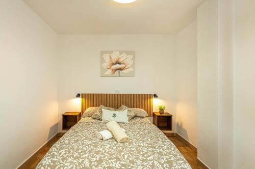 a bedroom with a bed with two pillows on it at Apartment in Los Cristianos WIFI in Arona