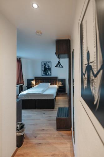 a bedroom with two beds in a room at Hotel Latio in Cologne