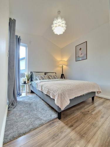 Postel nebo postele na pokoji v ubytování Mrozy House 2 - mały dom, duży spokój