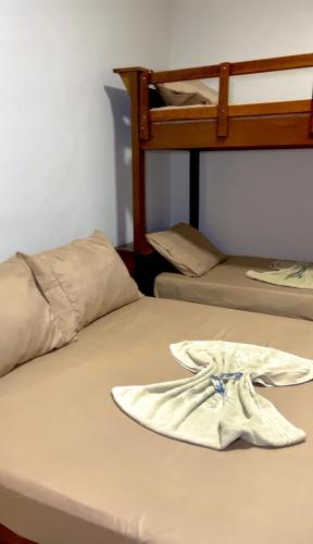 Ένα ή περισσότερα κρεβάτια σε δωμάτιο στο Pousada Catavento