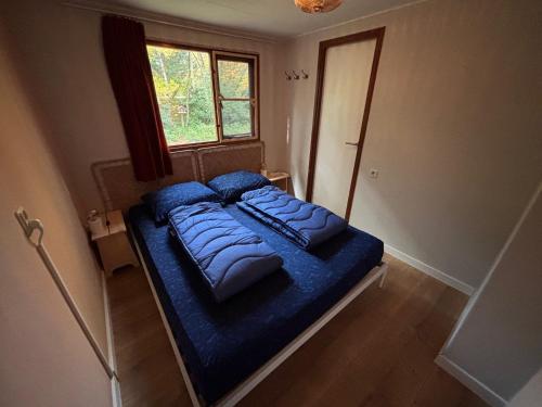 Ένα ή περισσότερα κρεβάτια σε δωμάτιο στο Chaletpark de Kempenbos - 196