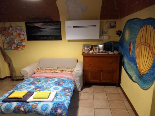 Postel nebo postele na pokoji v ubytování Casa Giulia on Francigena