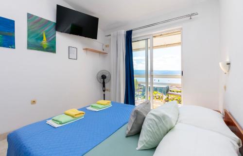 Postel nebo postele na pokoji v ubytování Apartments Boro