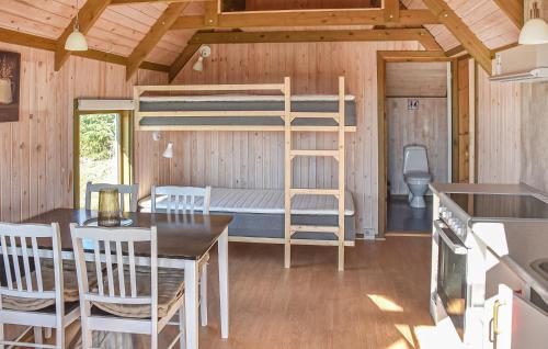 a room with a bunk bed in a tiny house at Stunning Home In Hanstholm With Private Swimming Pool, Can Be Inside Or Outside in Pugdal