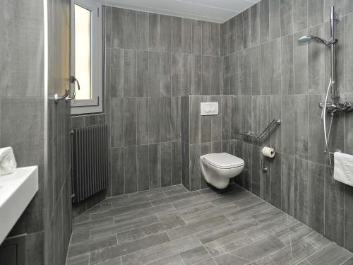 a bathroom with a toilet and a sink at ibis Lyon Centre in Lyon
