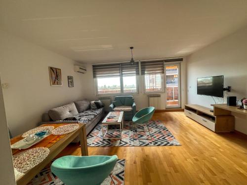 a living room with a couch and a table at Bulevar in Sarajevo