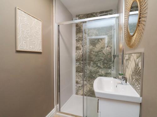 a bathroom with a shower and a sink at Apartment 2, Blackburn Heights in Bridlington