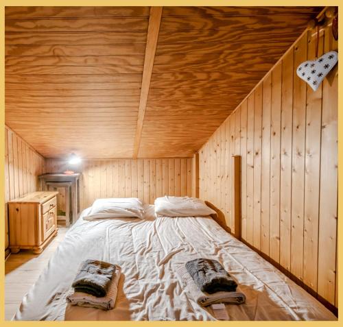 Postel nebo postele na pokoji v ubytování Le Chalet de Moudon I Les Gets