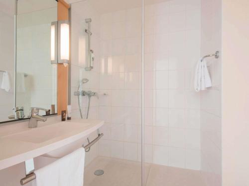 a bathroom with a sink and a shower at ibis Nantes Centre Gare Sud in Nantes
