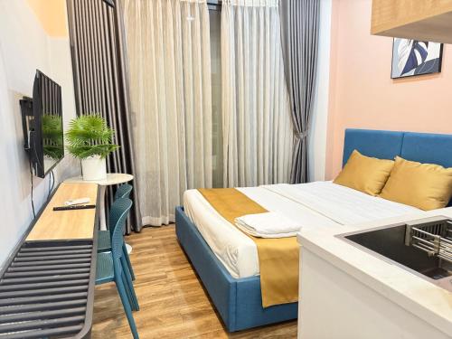 a small room with a bed and a sink at DreamHome - Starry in Ho Chi Minh City