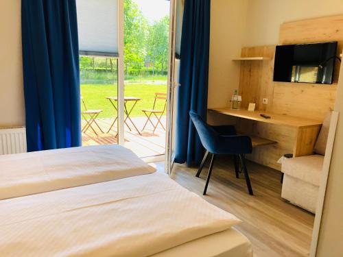 Postel nebo postele na pokoji v ubytování Gästehaus am Elberadweg by Hotel Alte Fischerkate