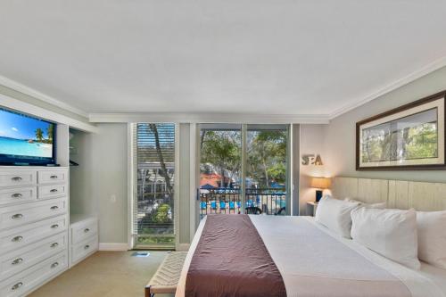 En eller flere senge i et værelse på Villa 332