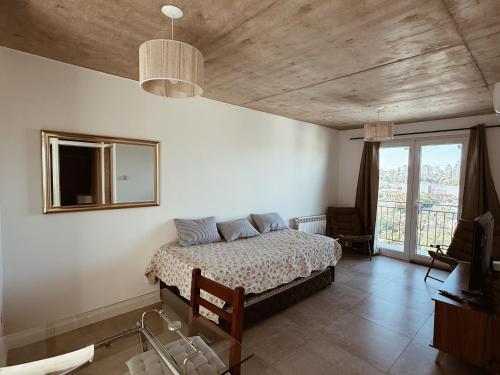 Ένα ή περισσότερα κρεβάτια σε δωμάτιο στο Maju