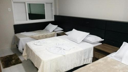 Postel nebo postele na pokoji v ubytování Sokulski Flat Hotel e Restaurante
