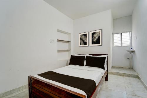 Ένα ή περισσότερα κρεβάτια σε δωμάτιο στο Hotel O ATR Residency