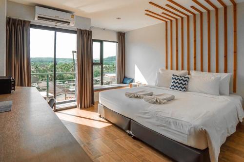 Ένα ή περισσότερα κρεβάτια σε δωμάτιο στο The Galla Hotel