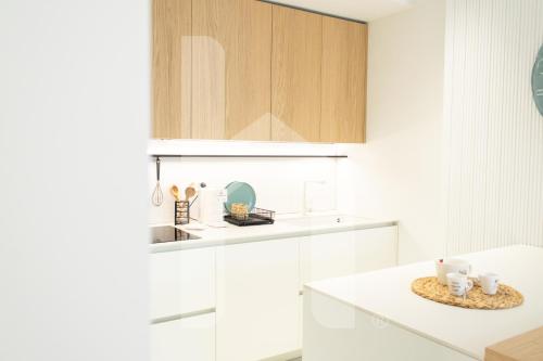 Kuchyň nebo kuchyňský kout v ubytování Homiday - Poseidon Luxury