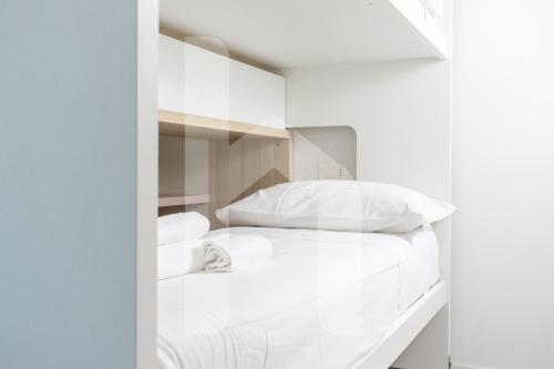 Postel nebo postele na pokoji v ubytování Homiday - Poseidon Luxury