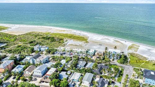 an aerial view of a beach with houses and the ocean at Toes in the Sand - 113 in Sarasota