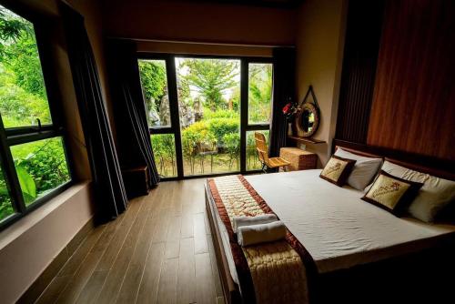 Postel nebo postele na pokoji v ubytování Khu Nghỉ Dưỡng Sinh Thái Charm Eco Retreat