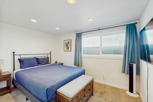 Ένα ή περισσότερα κρεβάτια σε δωμάτιο στο Pacific Blue