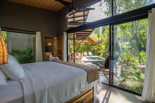 Postel nebo postele na pokoji v ubytování Villa Asencia with pool and AC near Arrecife beach